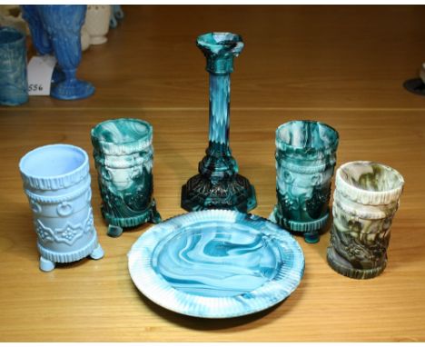 A pair of green malachite glass vases c.1900, cylindrical with faux ring handles and geometric rosette decoration, on three b