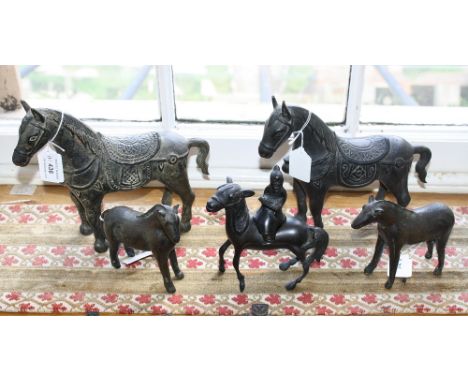 Four Oriental bronze horses 20th century, in the archaic style, 5in. to 8.5in. (12.75cm. to 21.5cm.) high; together with anot