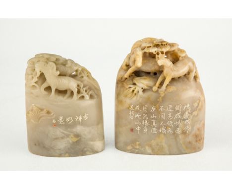 Two Chinese modern jade mountain carvings one in pale grey jade carved with grazing goats, incised with a single line of call