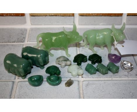 A small collection of modern Oriental figures including two pairs of pot bellied pigs, a cicada and tortoises, plus a pair of