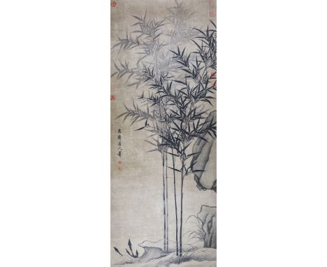 A Chinese watercolour scroll painting 20th century, depicting bamboo growing below a rocky outcrop, four character signature 