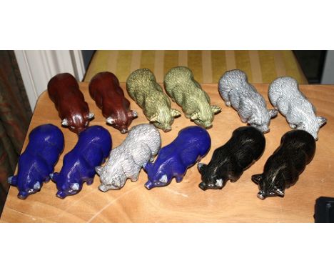 A set of twelve Oriental cloisonné enamel pig figurines.