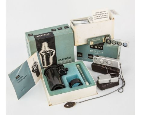 A Minox sub miniature camera with Complan 15mm. f3.5 lens, in leather case, together with a cased Minox flash unit, a boxed M