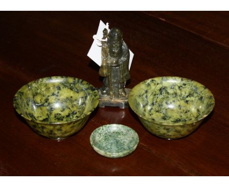 A pair of Oriental spinach jade dishes 3.75in. (9.75cm.) diameter, together with a smaller jade dish and a soapstone sage fig