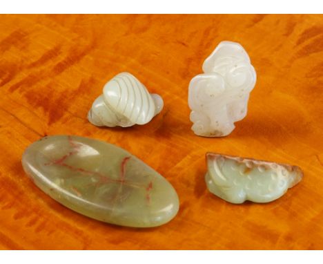 Four antique Chinese jade carvings comprising a whitish jade carving of two shells, with old collector's label, 3.2cm. long; 