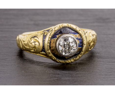 A Georgian yellow gold and diamond mourning ring with remains of black enamel, set with a single cushion cut diamond, approx.