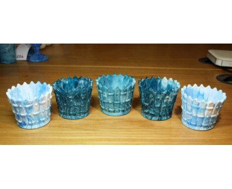 A pair of Victorian light blue malachite spill vases of flared ‘fence’ form, 2 5/8in. (6.7cm.) high; together three matching 