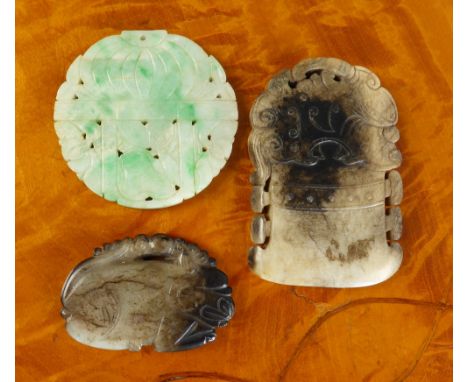 Three antique Chinese jade carvings comprising a pierced circular pendant plaque carved with a gourd on a table with flowers 