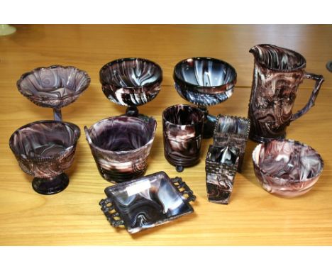 A pair of Victorian purple malachite sugar basins pedestal urn form, 4¾in. (12cm.) high; together with eleven other pieces of