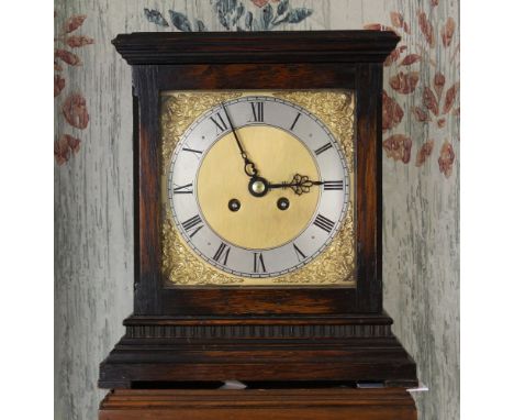 An early 20th century oak cased mantel clock the plain, early 18th century style case with square brass dial with Roman silve