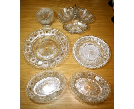 Sowerby clear pressed glass charger 12½in. (31.5cm.) diameter; together with a pair of matching oval dishes, 9in. (23cm.) lon