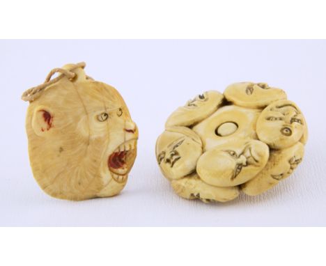 A Japanese carved ivory pendant Meiji period, in the form of the head of a screaming macaque, 4.8cm. long, together with a Ja