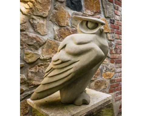 A cast stone owl sculpture 15½in. (39.5cm.) high, standing on a tree trunk base, 41in. (104cm.) high, ears chipped.