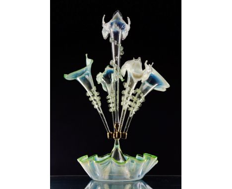 An Edwardian opalescent glass epergne probably Sowerby, with green and turquoise blue opalescence, the five trumpets with tur