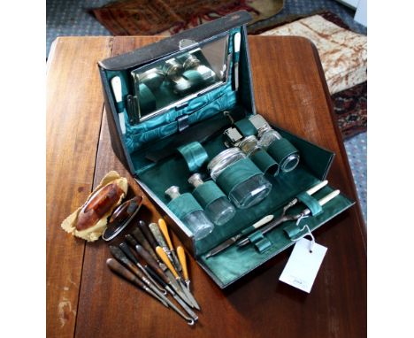 A leather gentleman's travelling case 1920s, with plated and cut glass contents (some lacking), plus a quantity of dressing c