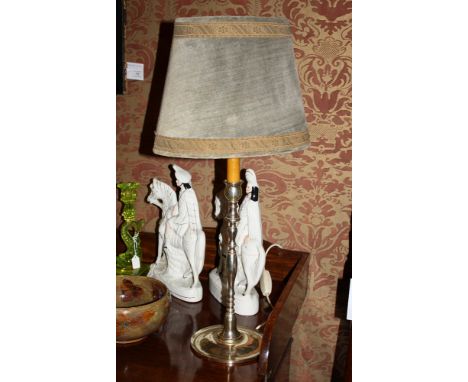 A pair of silver plated candlestick table lamps in the 18th century style, with green velvet shades, 14.75in. (37.5cm.) high 
