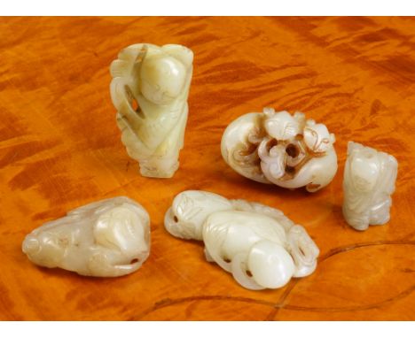 Five antique Chinese jade carvings comprising a whitish jade carving of two cats and a ruyi fungus, 4.4cm. long; a whitish an