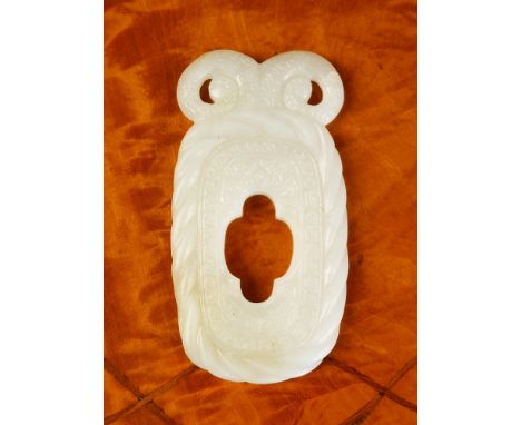 A Chinese white jade pendant with tints of russet inclusions to the lower end, of rounded rectangular form, the rope twist bo