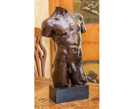 A bronze statue of a nude male torso signed 'Le Nantec' and dated '90, numbered 5/99' 11in. (28cm.) high.