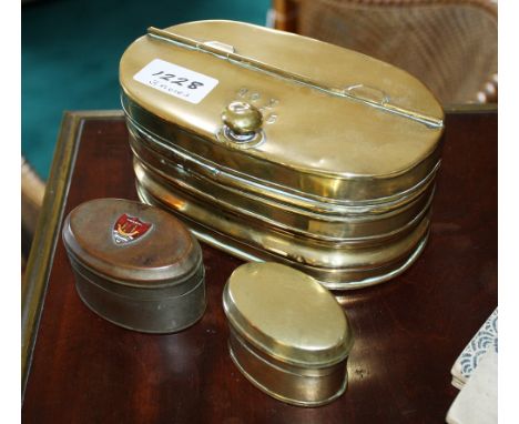 A Victorian oval brass tobacco box with repousse banded decoration, the hinged half-lid with stamped ??X 1905, 6½ x 3¾in. (16