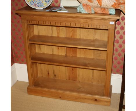A pine three shelf bookcase 40 x 40in. (101.5 x 101.5cm.).