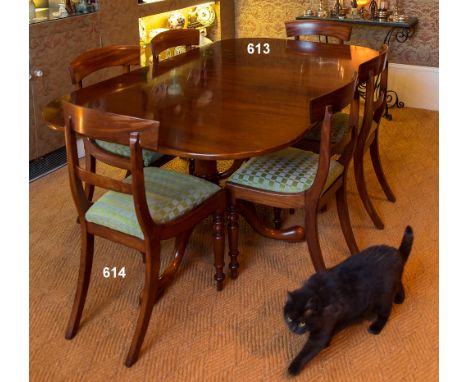 A George III style twin pillar mahogany dining table late 20th century, the pull-out extending top with two additional leaves