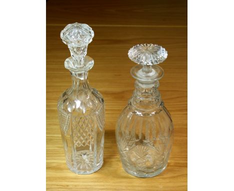 An early Victorian cut glass decanter the panel cut neck with three facet cut rings, over a panel, blaze and strawberry diamo