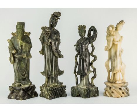 Four Chinese carved soapstone figures second half 20th century, one depicting a scholar, the other three Guanyin, three in gr