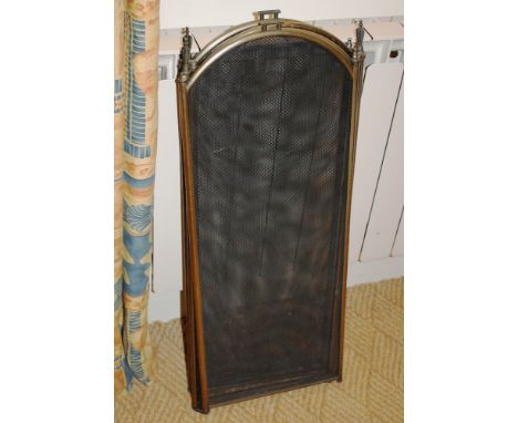 A brass folding fire screen.