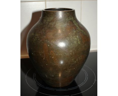 A 1930s WMF bronze vase of tapered ovoid form, with mid-brown patination and etched stylised decoration, impressed factory ma