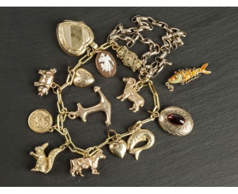 A 9ct yellow gold charm bracelet early 20th century, the oblong link bracelet with eleven 9ct gold charms and one rolled gold