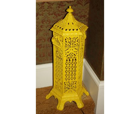 A 19th century style French cast metal heater style lamp yellow painted, of hexagonal form, with pagoda top, pierced foliate 