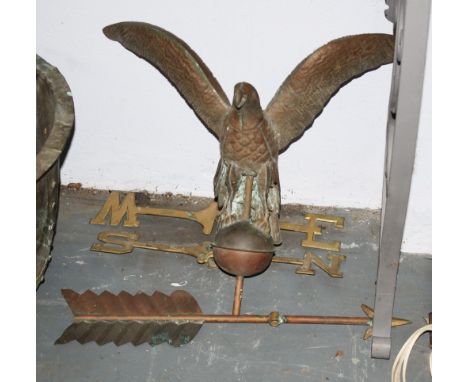 A brass eagle weather vane
