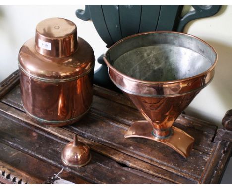 An antique copper beer barrel funnel 10¼in. (26cm.) high; together with a small copper funnel; and a copper shop's tea caddy 