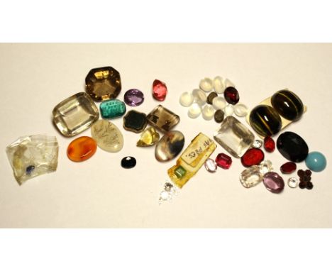 A quantity of loose precious and semi-precious stones cut and cabochon, including a small square cut emerald; an oval cut sap