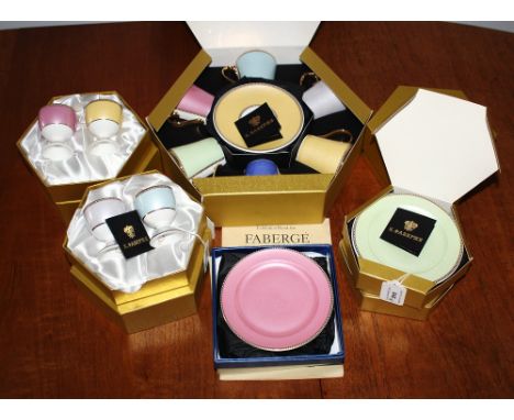 The Royal Collection Carl Faberge style bone china in the style of Faberge guilloche enamel pieces, comprising a boxed twelve