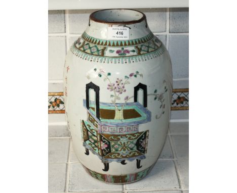 An antique Chinese famille rose vase probably early 19th century, of ovoid form with enamelled decoration of peonies and prun