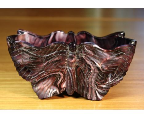 A rare purple malachite glass butterfly posy trough the shaped oblong vase decorated to either side with a relief moulded but
