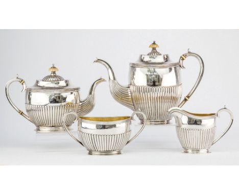 A Russian silver four piece tea and coffee service second relief Kokoshnik mark, St Petersburg, maker's mark IKA, comprising 