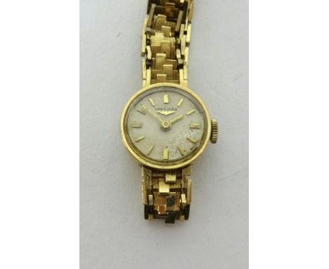 Longines, ladies 9ct gold wristwatch on bracelet, 15mm round pale champagne coloured dial with batons, seventeen Swiss jewell