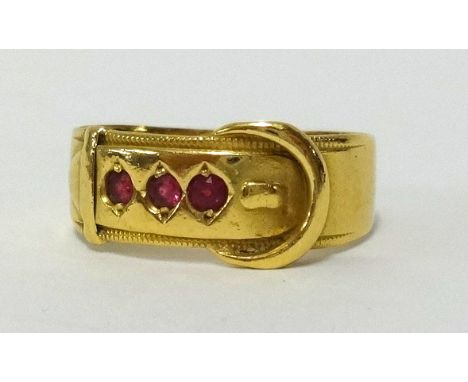An 18ct ruby set buckle ring approx 4.2gms, finger size Q.