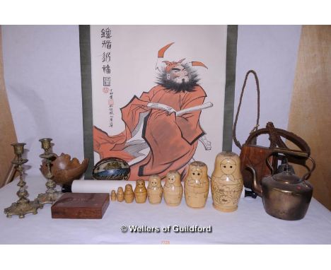 A quantity of bric-a-brac including Russian dolls, cow bells, copper kettle, A Chinese scroll painting depicting a scholar, 8