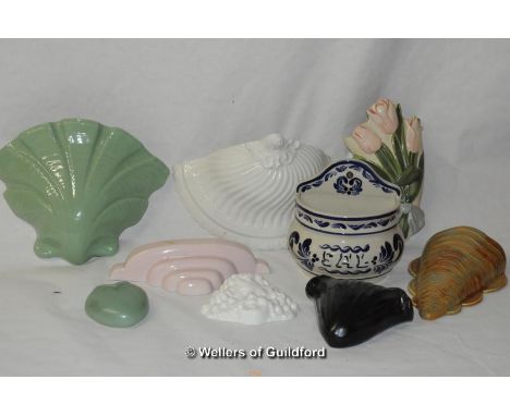 A quantity of ceramic wall pockets.