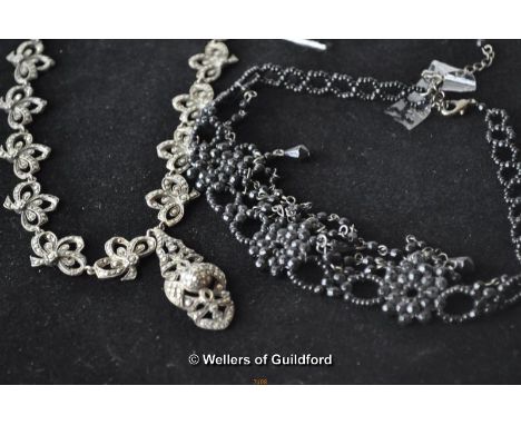 A vintage silver and marcasite necklace; a vintage black beaded necklace.