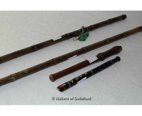 Two Chinese bamboo end flutes, the longest 84.5cm,  a small woodwind instrument and a recorder (4).