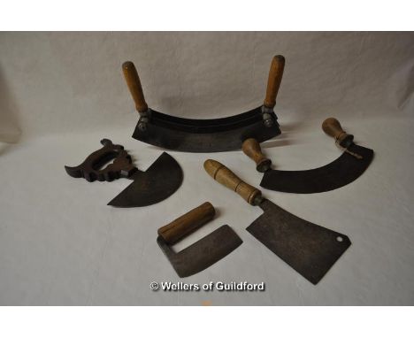 Vintage kitchenalia: five different chopping or cutting tools.
