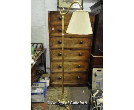 A modern brass standard lamp with shade.