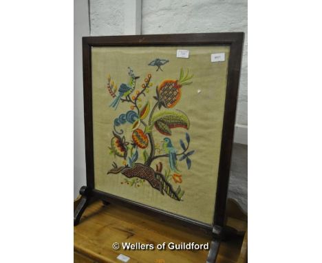 A 1920's firescreen with woolwork panel.