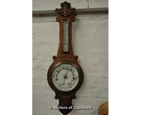 A Victorian walnut banjo aneroid barometer with thermometer, 89cm.