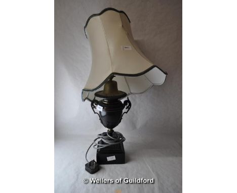 A bronzed twin handled urn shaped table lamp with shade, 44cm to top of fitting.